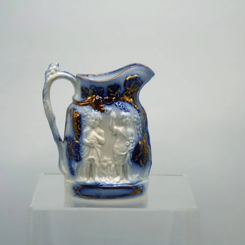 Flow Blue Relief Molded Jug with  Copper Lustre