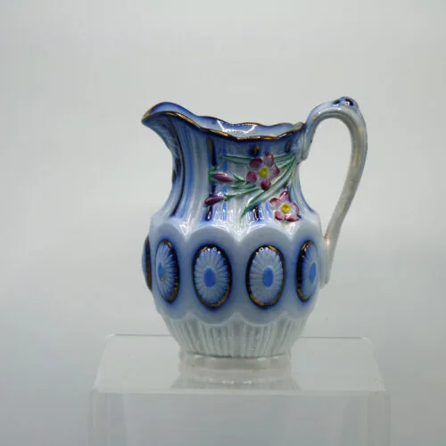 Flow Blue Relief Molded Jug with Copper Lustre and Colours