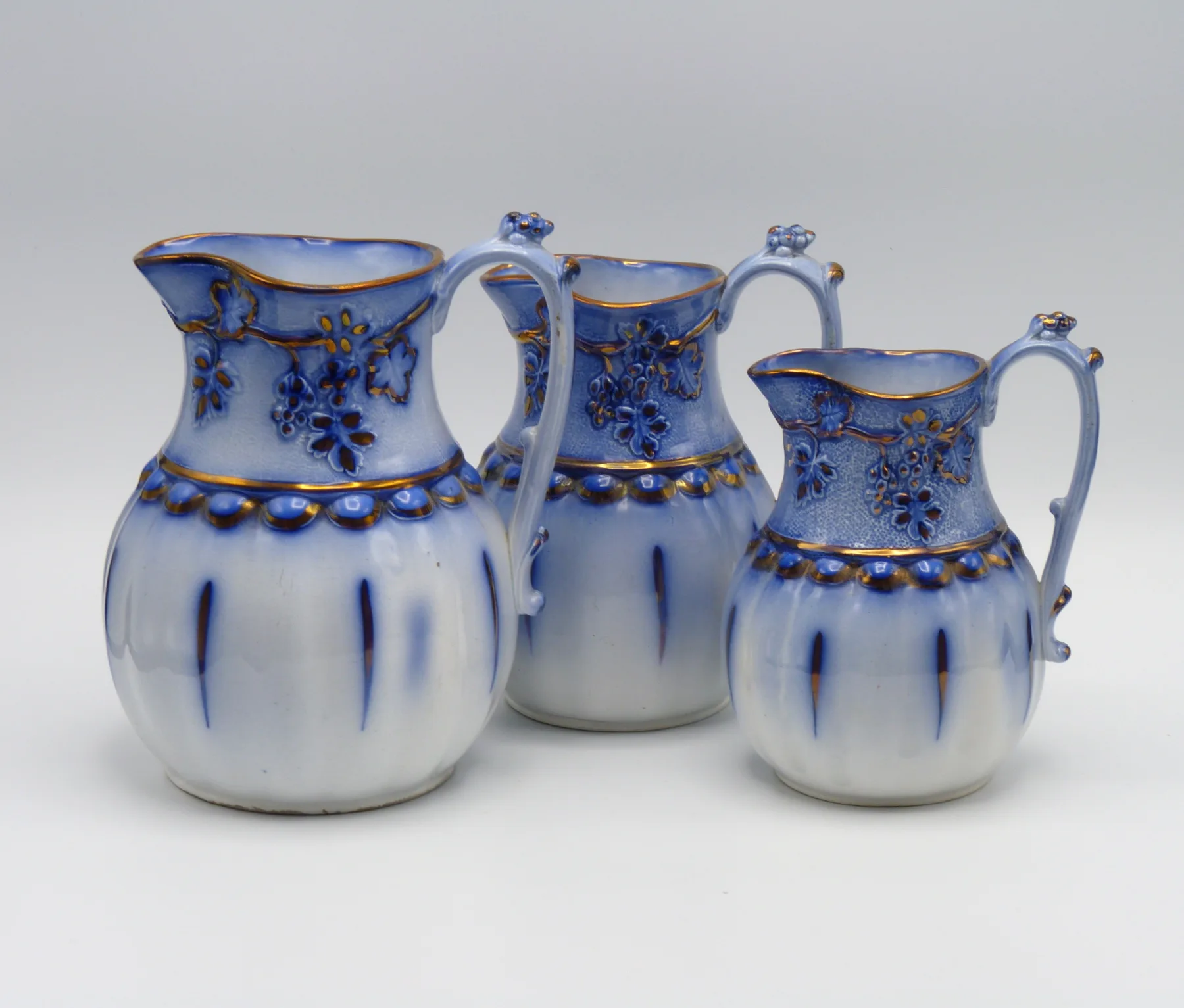 3 Graduating Flow Blue & Copper Lustre Relief Moulded Jugs - Image 3