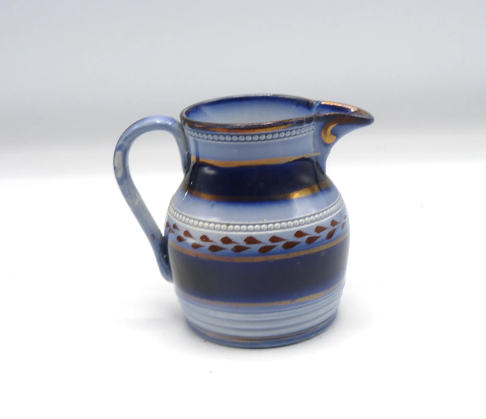 Small Flow Blue Creamer - Wagon Wheel