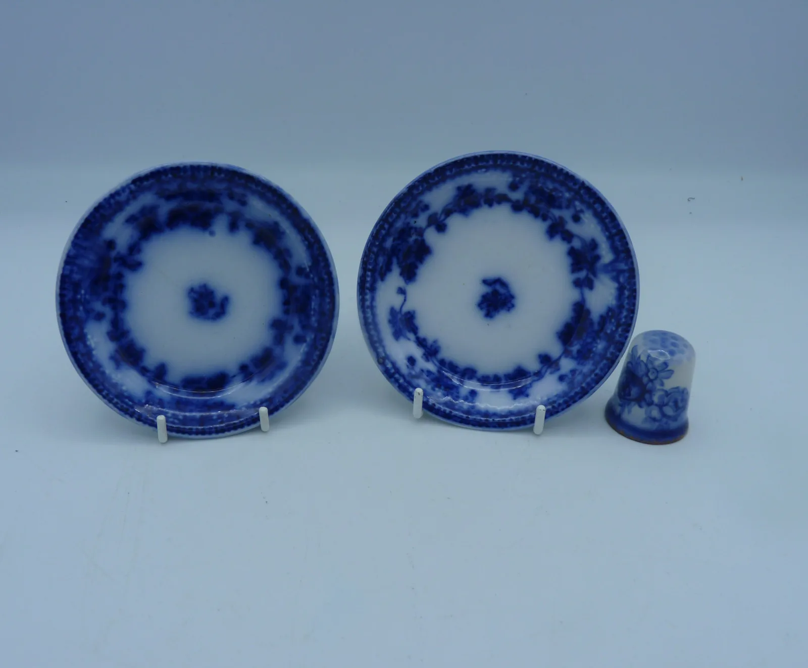 A Pair of Flow Blue Butter Pats