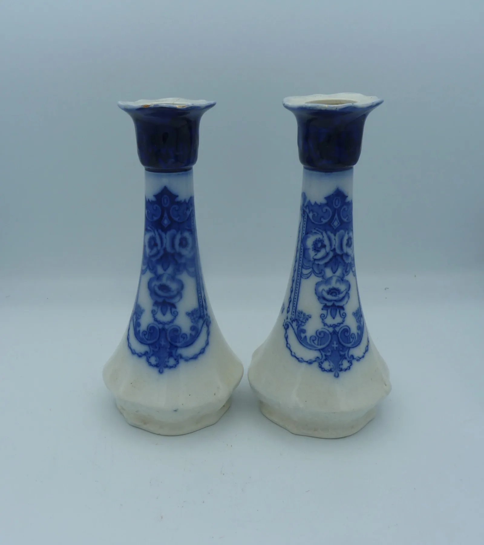 A Pair of Flow Blue Candlesticks – 1 a/f